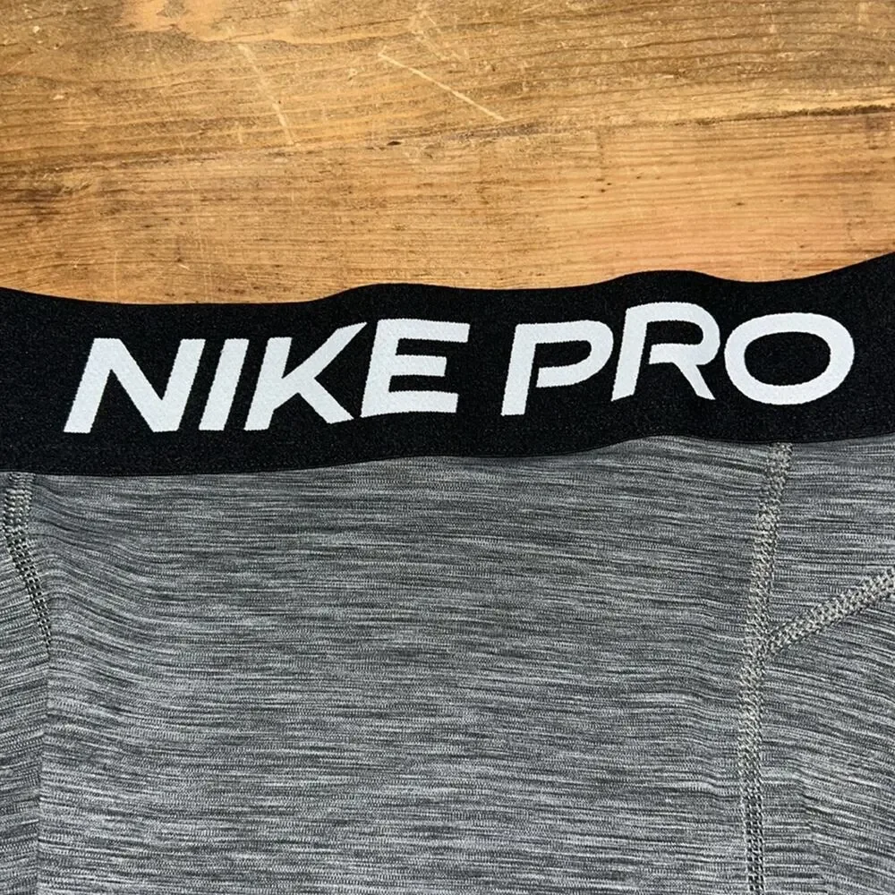 Woman’s Nike Pro Heather Gray with black mesh Leggings Size Small